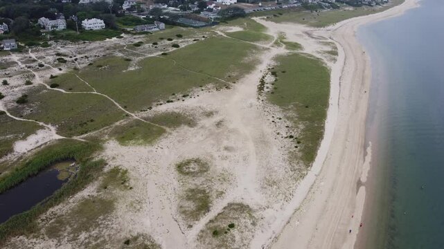 Aerial Drone View Flying Over Sandy Beach and Coastal Dunes in Cape Cod, Massachusetts