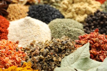 Many different spices as background, closeup view