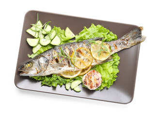 Tasty roasted seabass fish with vegetables and lemon isolated on white, top view. Homemade seafood dish