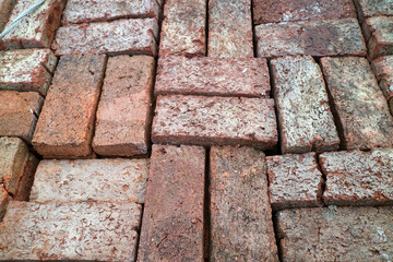 Weathered Red Bricks in Herringbone Pattern