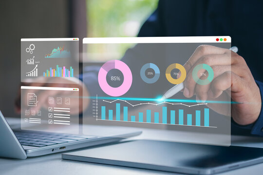 Business analysis. Businessman working on laptop computer analyzing finance sales data and economic growth graph chart and financial report, business and technology concept