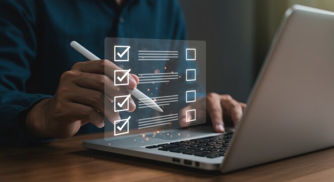 Professional using stylus with digital checklist. Organized task management on laptop. Modern productivity and workflow efficiency.