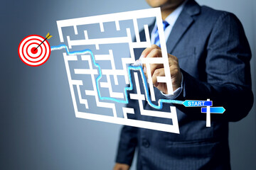 Business guide concept with businessman start go in the maze by guide line to target dartboard...