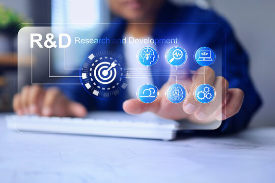 Research and development concept with businessman pointing on search icon represent that combines various technology such as programming, AI, and creativity idea to innovative products
