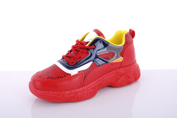 Colorful and modern athletic shoe displayed on a clean surface with a bright background, showcasing its unique design for casual wear and sports activities