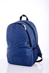 Durable denim backpack with multiple compartments designed for everyday use and travel convenience