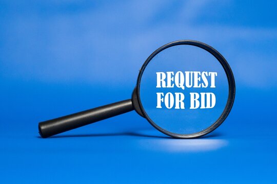 REQUEST FOR BID is written on a magnifying glass with a blue background.
