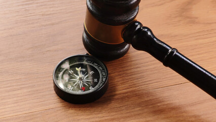 Gavel and Compass on Wooden Table © MohamadFaizal
