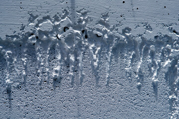 Dripping White Paint Texture on Blue Surface with Drying Effect