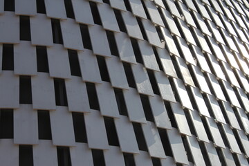 Modern Building Facade with Angled White Panels, Architectural Design Detail