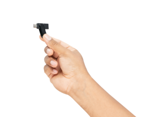 Hand holding usb stick on white background