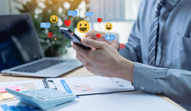 Businessman enjoying social media on mobile phone with floating notification icons for likes, messages, and comments. Concept of digital engagement and online communication. - Powered by Adobe