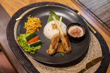 A sumptuous array of lunch offerings on a luxury Phinisi yacht in Labuan Bajo, featuring a diverse...