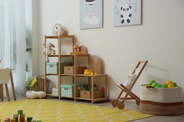Stylish playroom with toys and furniture. Interior design