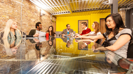 The Media Agency: Creative Colleagues. A candid view of a project team meeting of creative...