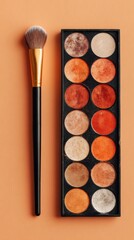 Flatlay of Eyeshadow Palette and Brush.