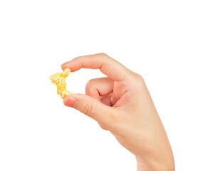 Female hand holding popcorn isolated on white background.