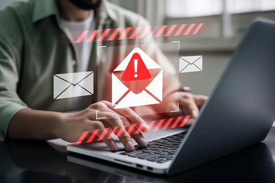Spam email alert danger concept. person typing on laptop receives scam notification, illustrating cybersecurity risk and data breach threat in modern digital workspace.