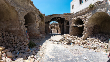 Desolate Urban Ruins Under Blue Sky. Destroyed Aleppo souk, Syria