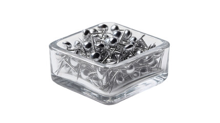 Fototapeta premium A clear glass container filled with silver push pins on a transparent background in a studio setting