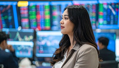 An Asian businesswoman analyses stock market data