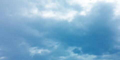 Blue sky, sun, clouds. A peaceful moment with underlying complexity. A reflection of the sky on thin clouds. Hidden emotions beneath a bright exterior like feeling melancholic on a good day background