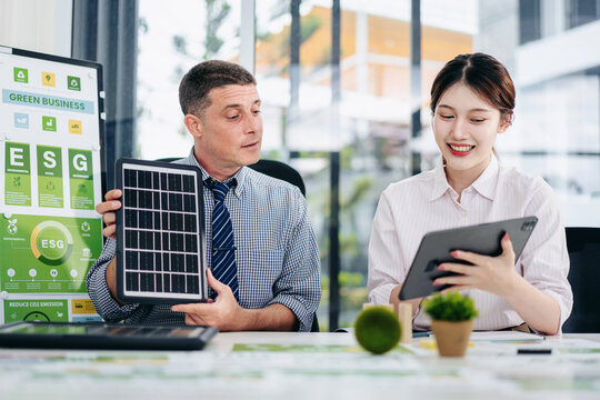 Sustainable Business Leaders Collaborating on ESG Strategy Carbon Emission Reduction and Green Technology