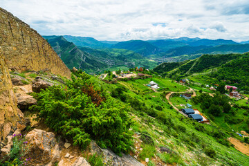 Beautiful view of green mountain valley and fortification wall of Russian fortress Gunib. Dagestan, Caucasus