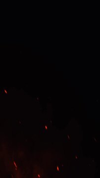 red fire sparks with black background in vertical video format