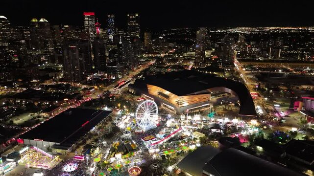 Aerial North View of Calgary Stampede Midway with Spinning Ride and Skyline