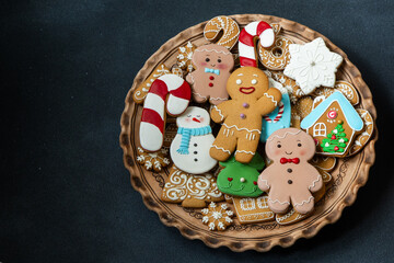 Gingerbread cookies with icing decoration. Christmas food. Gingerbread man baking. Xmas sweet on...