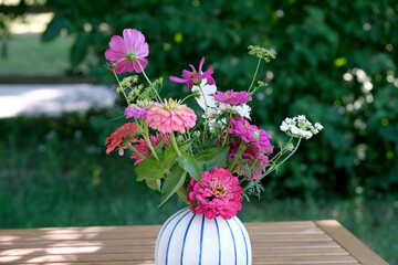 Colorful bouquet of wildflowers in a sunlit garden setting