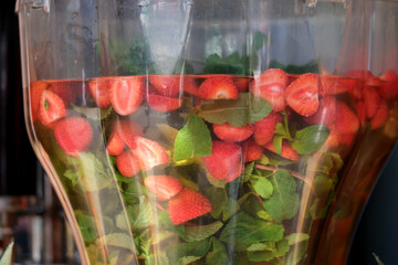 Refreshing strawberry mint beverage served at a summer festival