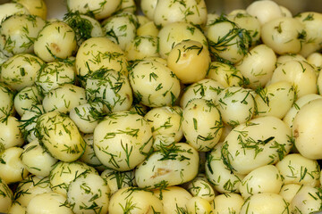 Freshly harvested potatoes with fragrant dill ready for cooking