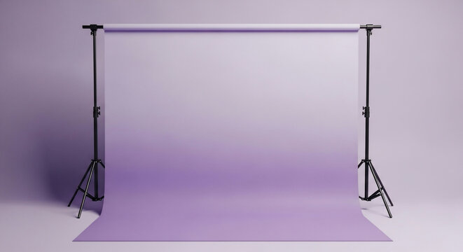 Empty photography studio setup with a purple seamless paper backdrop creating a gradient background