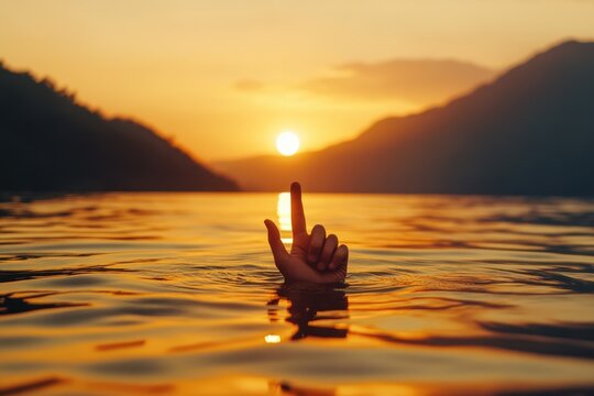 Man kayaking in a serene lake at sunset with fingers dipped in water, man puts fingers down in lake kayaking against backdrop of golden sunset, unity harmony nature