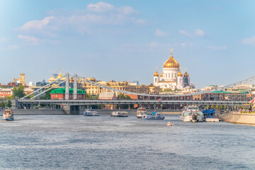 Cruise ship sails on the Moscow river in Moscow city center, popular place for walking.