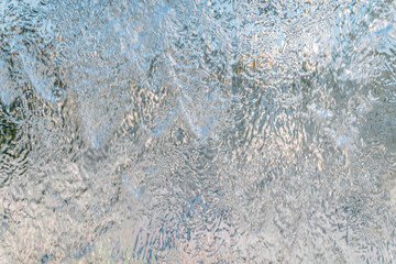 Aqua background. Product space next to clean water streams and water splashes and drops.