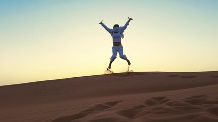 Business woman celebrate victory jumping barefoot on Desert dune at sunset in Dubai - Powered by Adobe