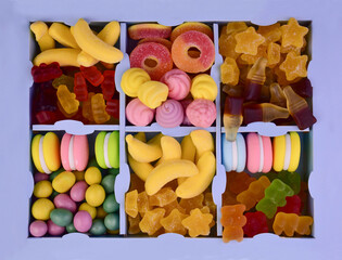 Multicolored assortment of sweets confectionery, jelly candies in a box. Flat lay.
