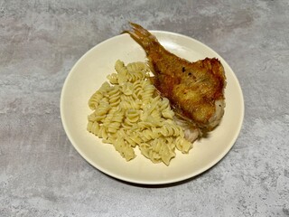 Homemade dinner fried perch with pasta. High quality photo