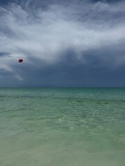  Pink football in the air over the Gulf of Mexico water