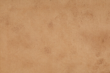 Old vintage brown paper texture background. Grunge cardboard surface with stains, perfect for retro or rustic design projects.