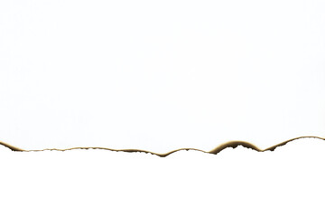 Burnt paper edge with an uneven, wave-like line. Grunge vintage border texture for design or separating elements. isolated on white background with clipping path.
