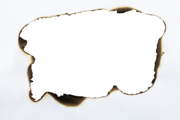 Large burnt hole in white paper creating a grunge frame with scorched edges from fire. Abstract vintage template for text or photos. isolated on white background with clipping path.