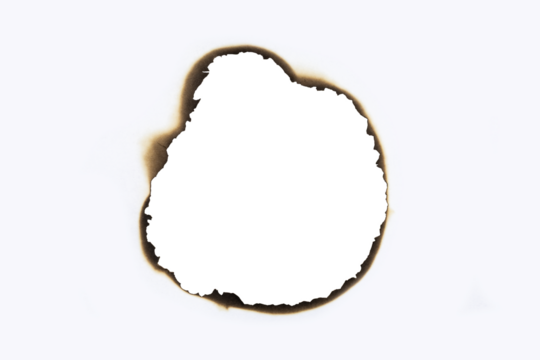 Burnt hole in a white paper sheet creating a grunge frame with scorched edges from fire. Vintage abstract design element for text or photos. isolated on white background with clipping path.