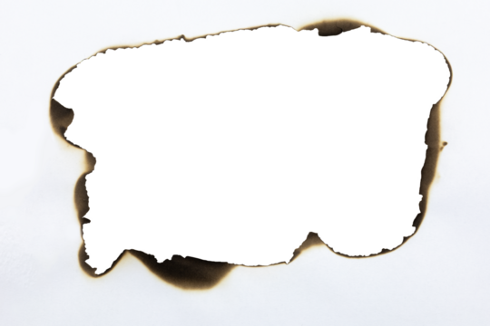 Large burnt hole in white paper creating a grunge frame with scorched edges from fire. Abstract vintage template for text or photos. isolated on white background with clipping path.