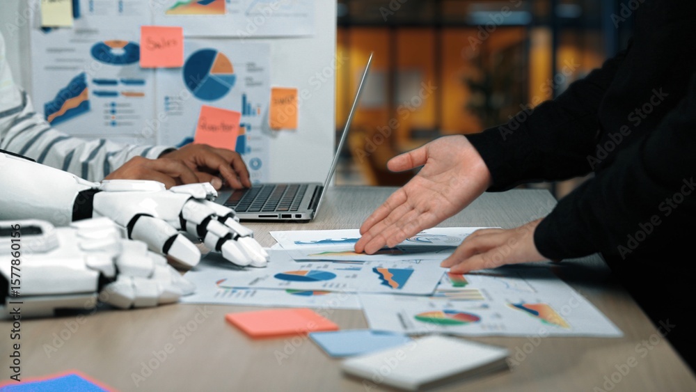Poster a high-tech business meeting featuring a robotic hand assisting with data analysis on charts and gra
