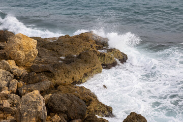 Stunning Torredembarra Lighthouse on rugged Mediterranean cliffs at Punta de la Galera, Tarragona, Catalonia. Perfect seaside nature and maritime beauty.
