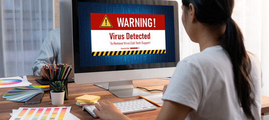 Virus warning alert on computer screen detected brisk cyber threat , hacker, computer virus and...